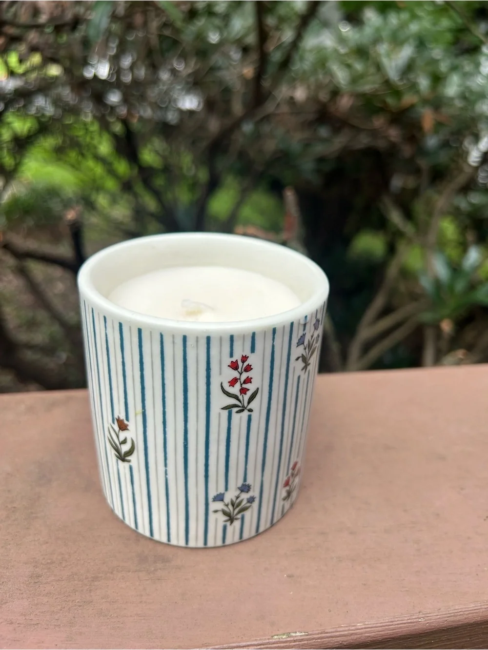 Anthropologie White Ceramic Candle with Blue Stripes and Red Floral Accents